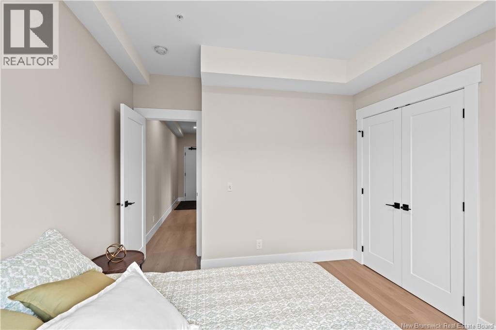 A bedroom with a bed and a wardrobe.