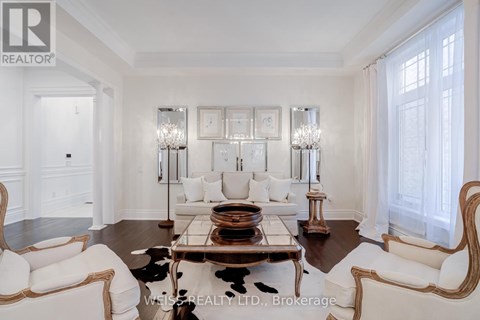 A living room with a white couch and a coffee table.