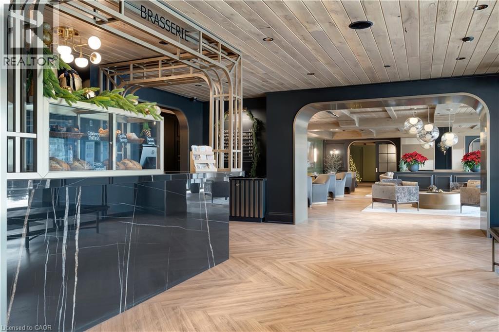 A modern interior space with a wooden floor and a glass wall.