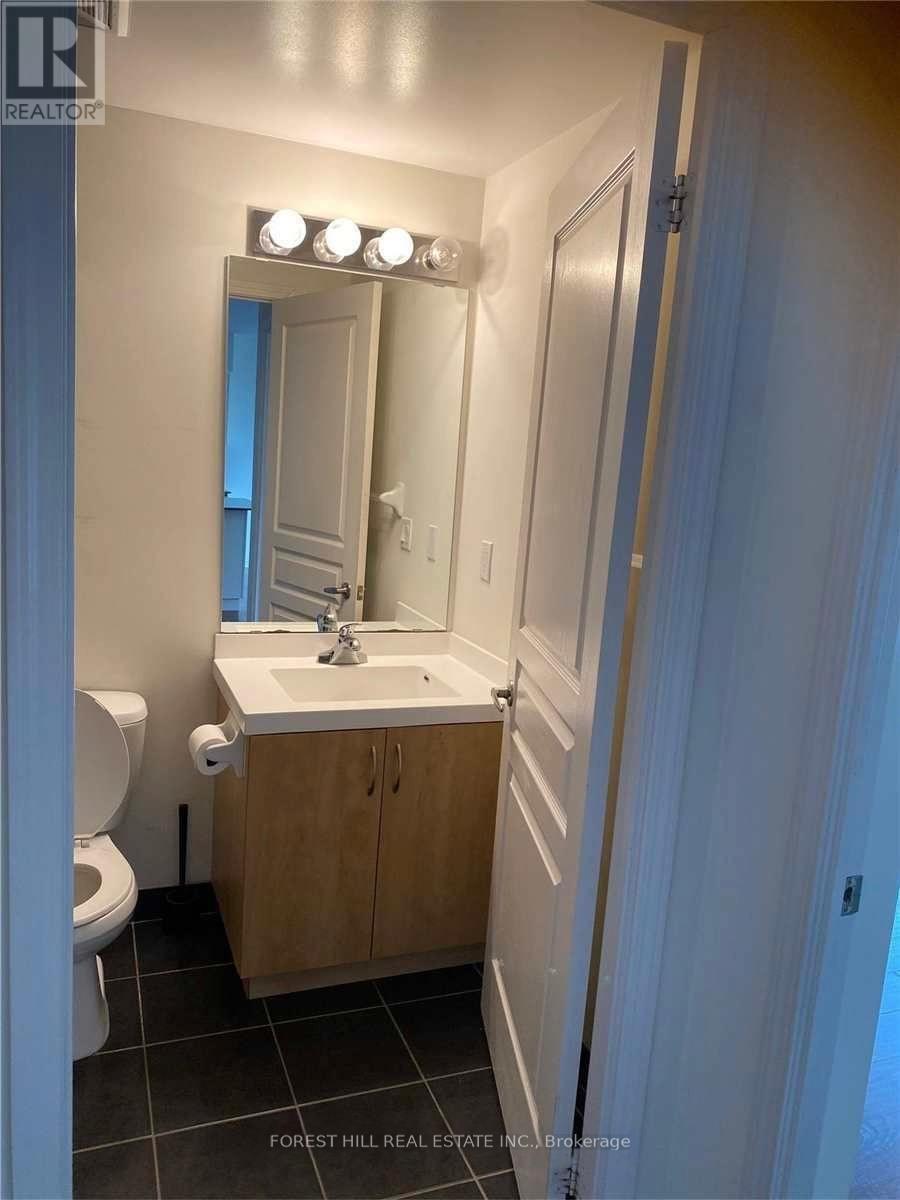 A bathroom with a sink, mirror, and lights.