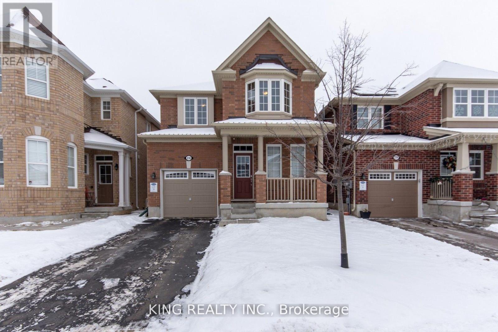 A house with a snow-covered front yard.