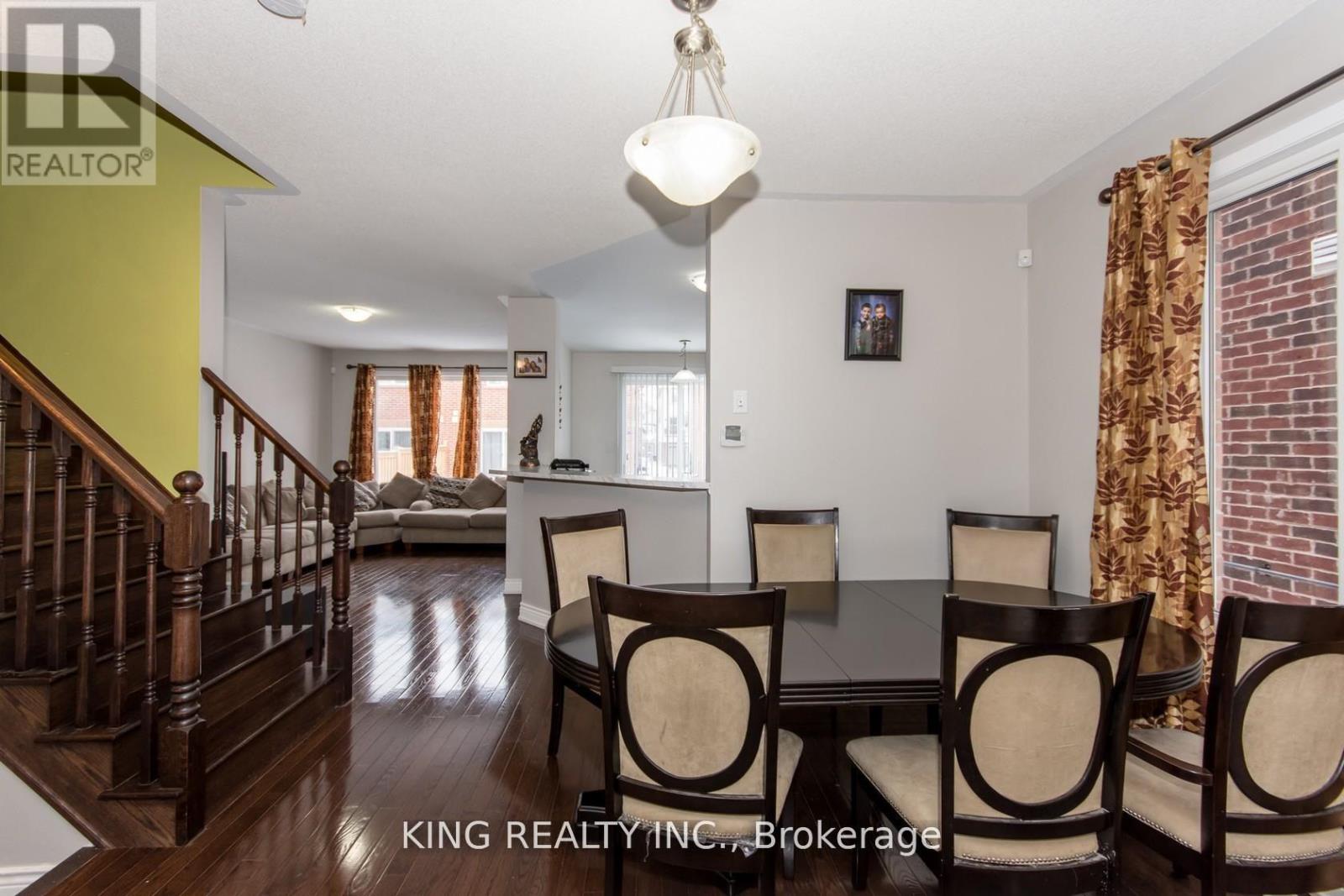 A dining room with a table set for four.