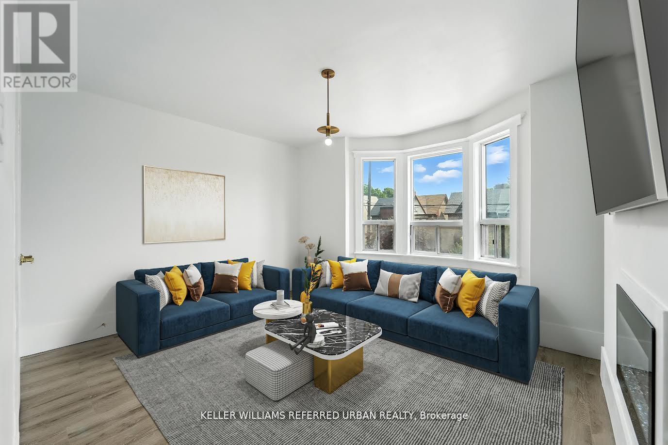 A living room with a blue couch and a coffee table.