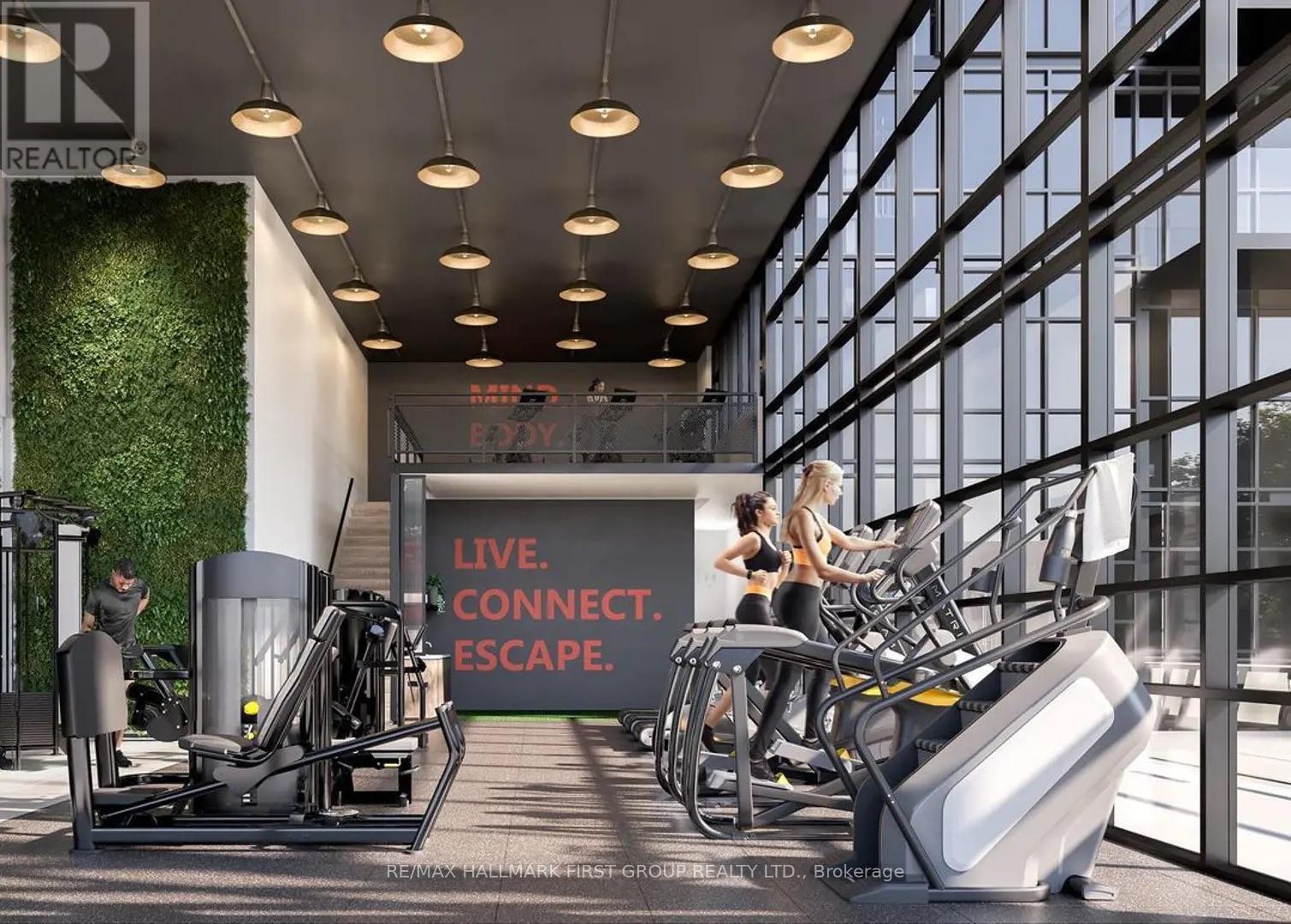 A gym with a green wall and a sign that says "Live. Connect. Escape."