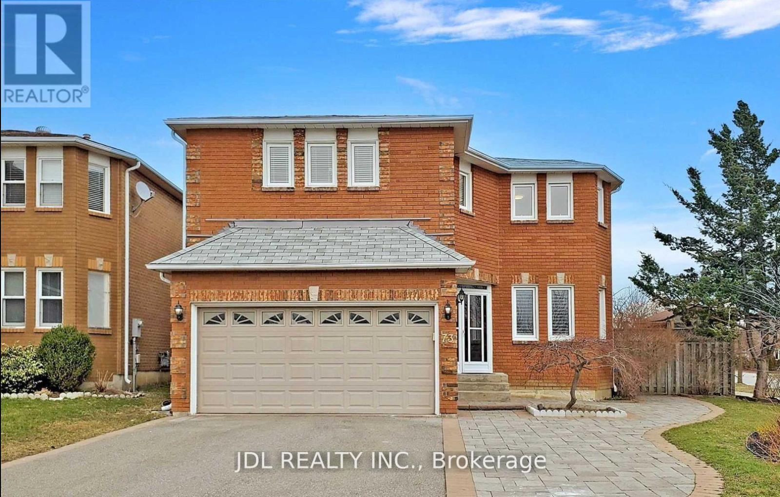 A house with a garage is for sale by JDL Realty Inc.