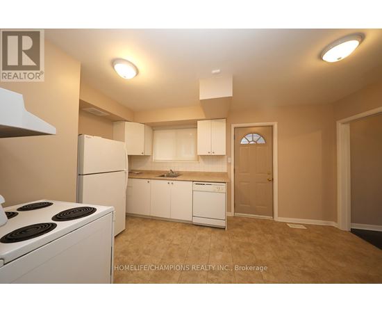 A small kitchen with white appliances and cabinets.