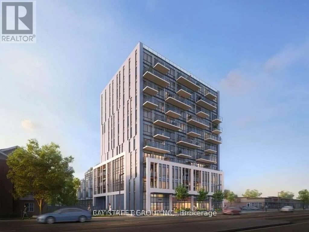 A modern multi-story building with a glass facade is depicted in the image.