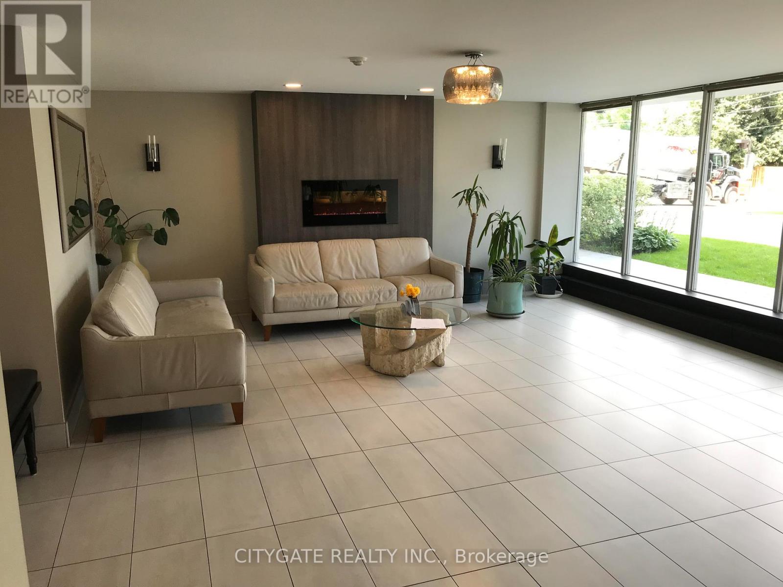 A living room with a fireplace and a couch.