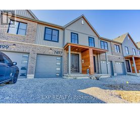 A modern two-story house with a garage is for sale.