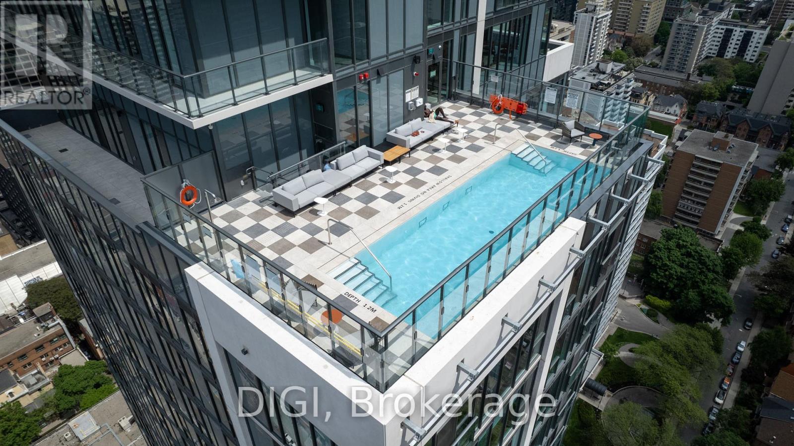 A swimming pool on the roof of a building.