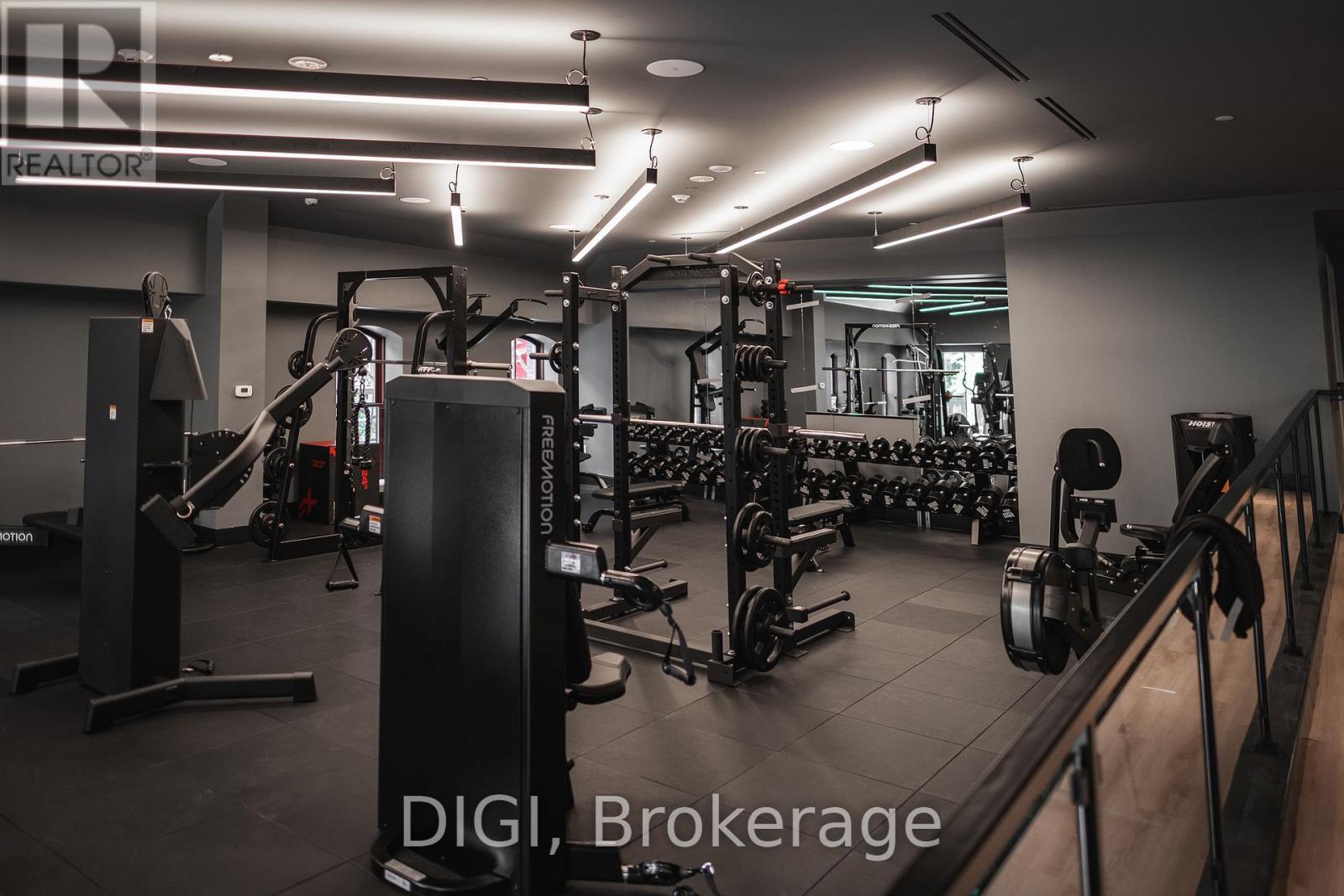 A gym with various exercise equipment and a sign that reads "REALTOR".