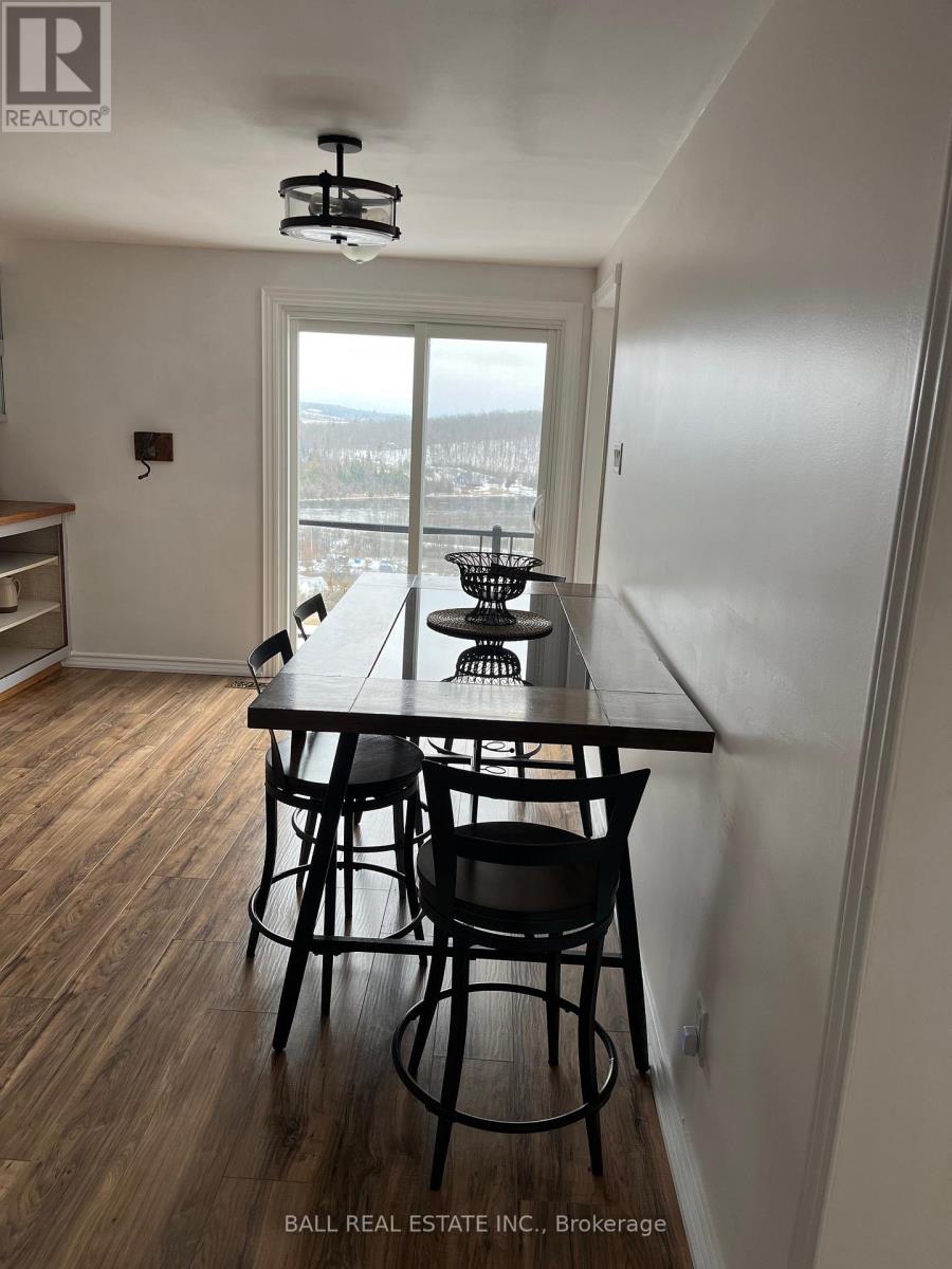 A dining room with a table and chairs is shown.