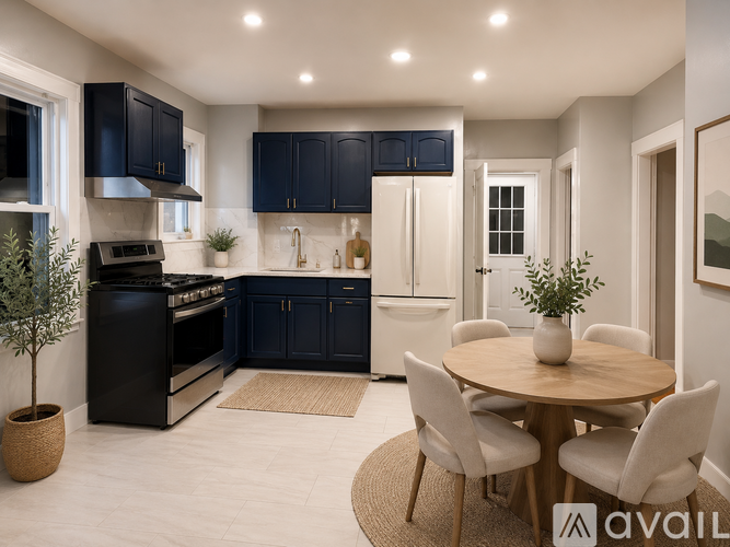 A modern kitchen with dark blue cabinets and a central island.