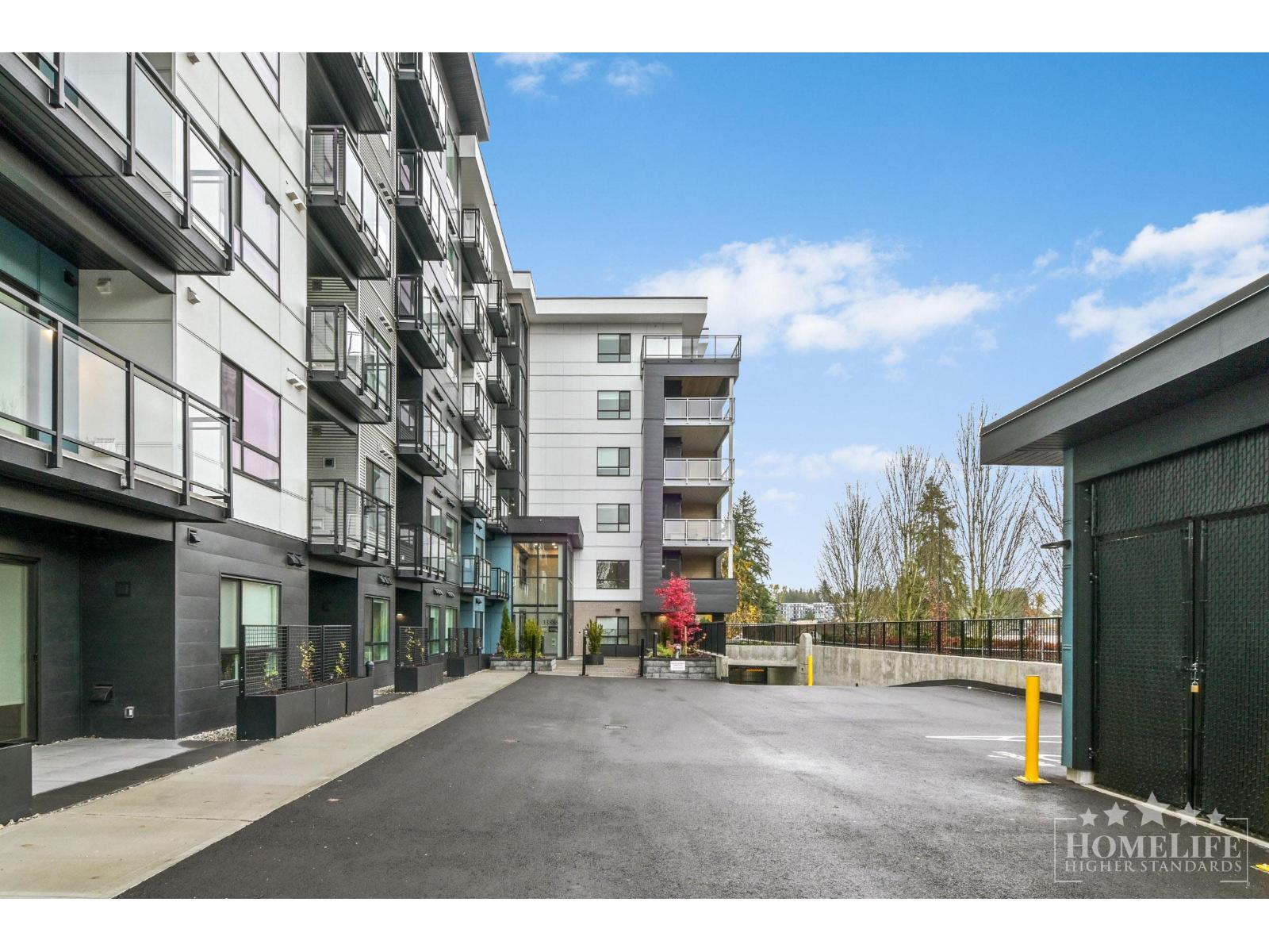 A street view of a residential area with apartment buildings on both sides.