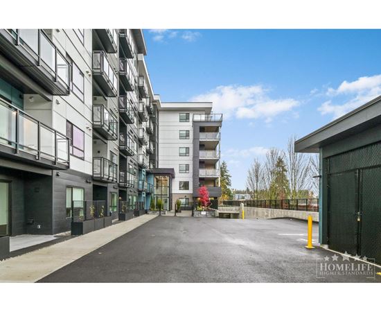 A street view of a residential area with apartment buildings on both sides.
