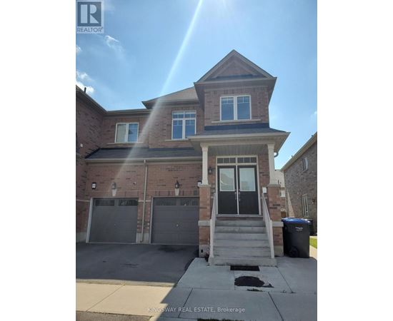 A house with a garage and a trash can in front of it.