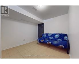 A bedroom with a bed and a wardrobe.