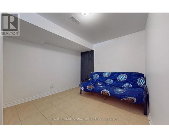 A bedroom with a bed and a wardrobe.