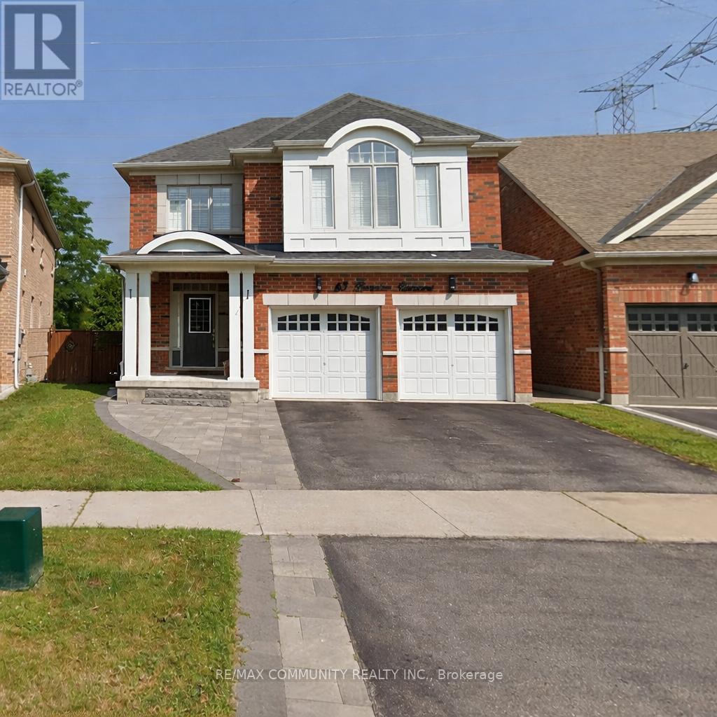 A house with a brick facade and a white garage door.