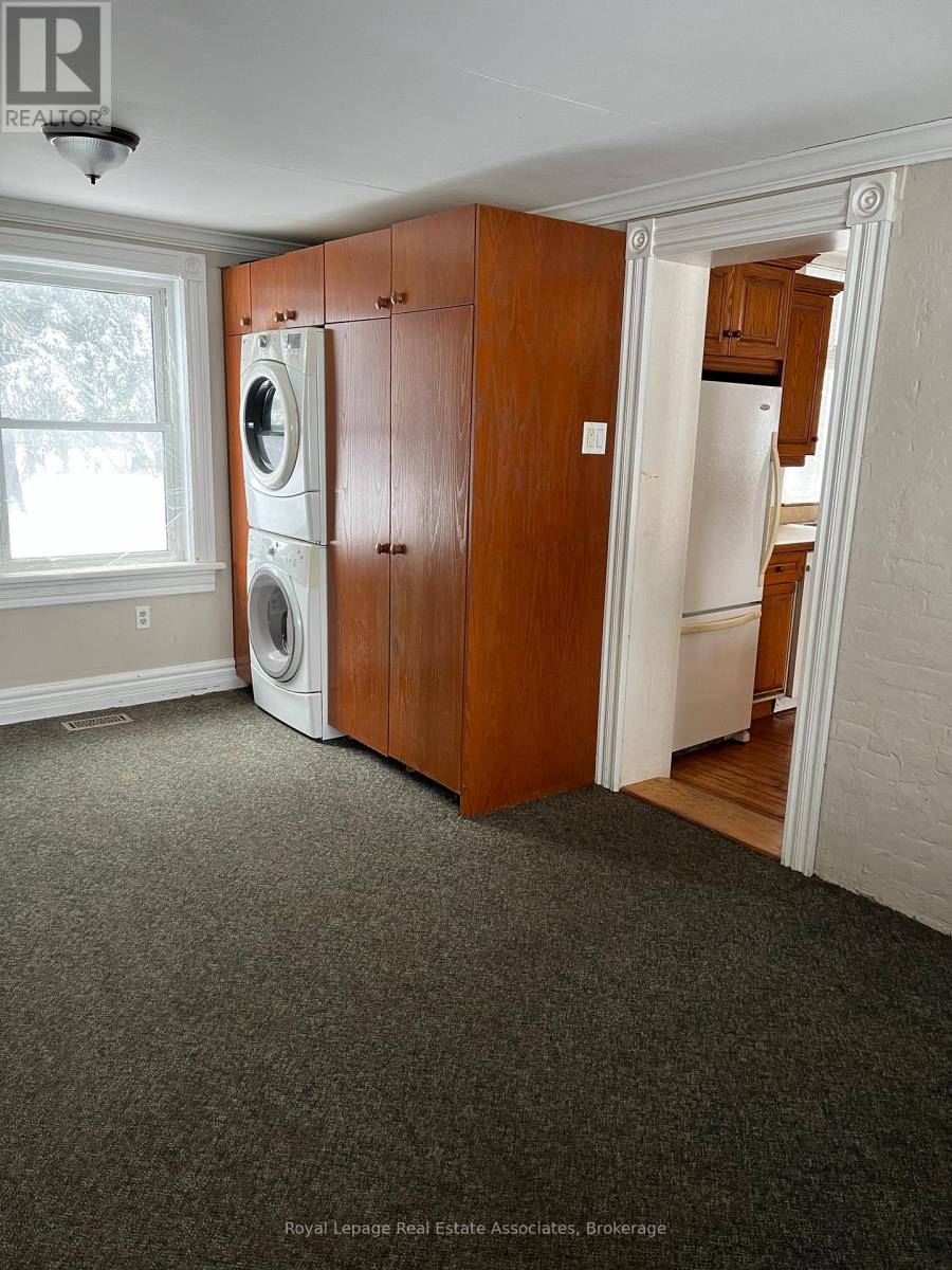 A laundry room with a washer and dryer in it.
