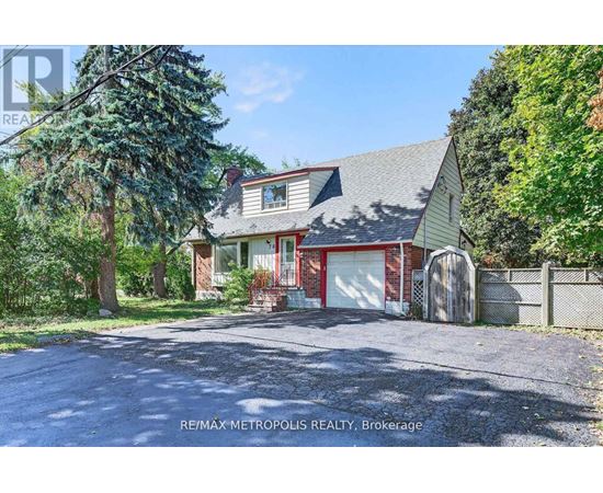 A house with a red garage door is for sale in Brokerage.