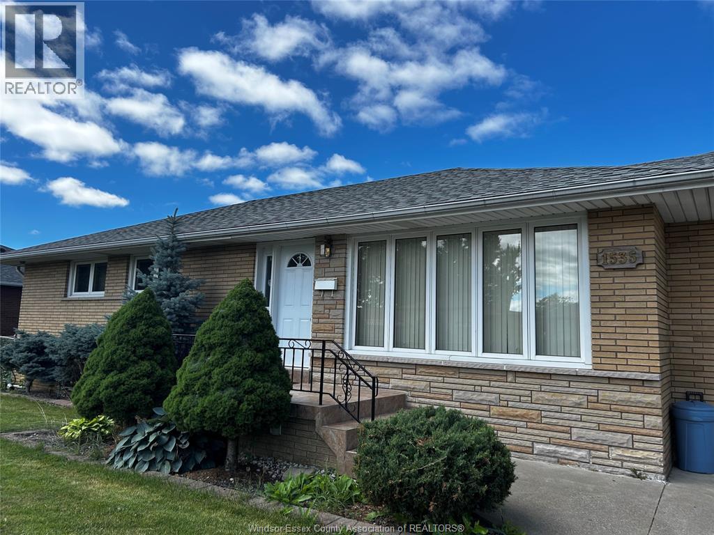 A house with a white door and windows is for sale.