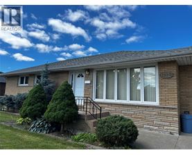 A house with a white door and windows is for sale.