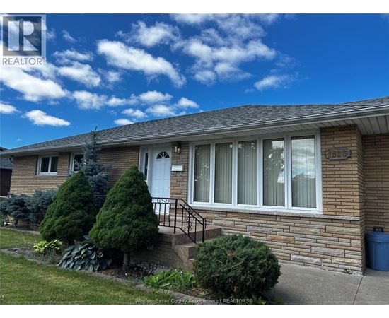 A house with a white door and windows is for sale.