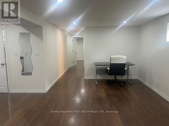 A room with a desk and a chair in it.