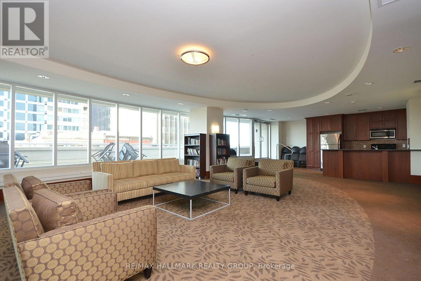 A living room with a large couch and a coffee table.