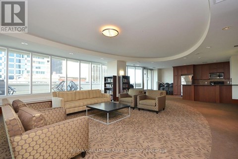 A living room with a large couch and a coffee table.