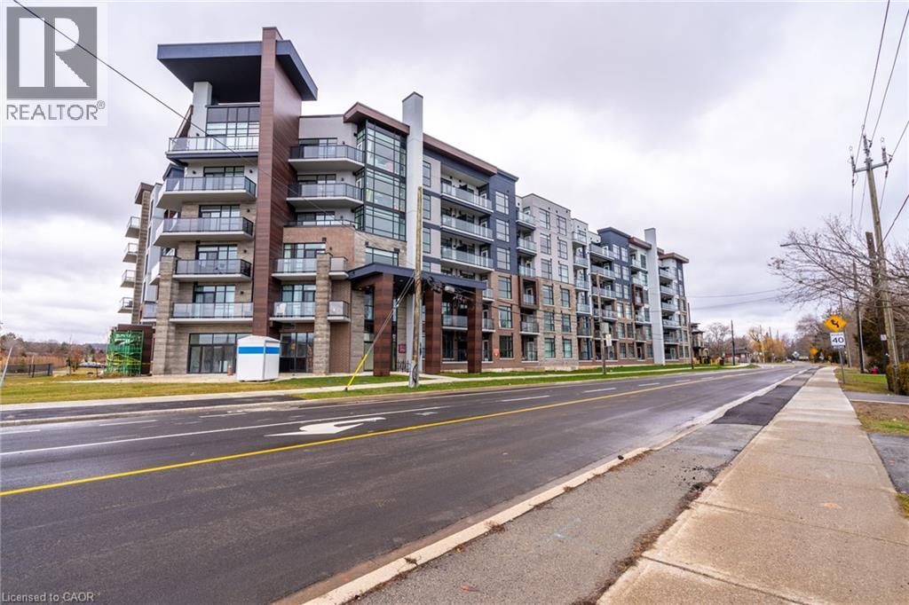 A large apartment building with a REALTOR® logo on the top left corner.