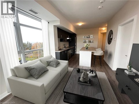 A living room with a white couch and a coffee table.