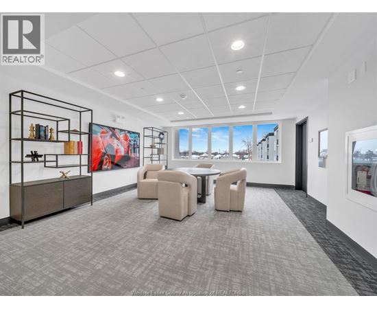 A spacious office room with a large table and chairs.