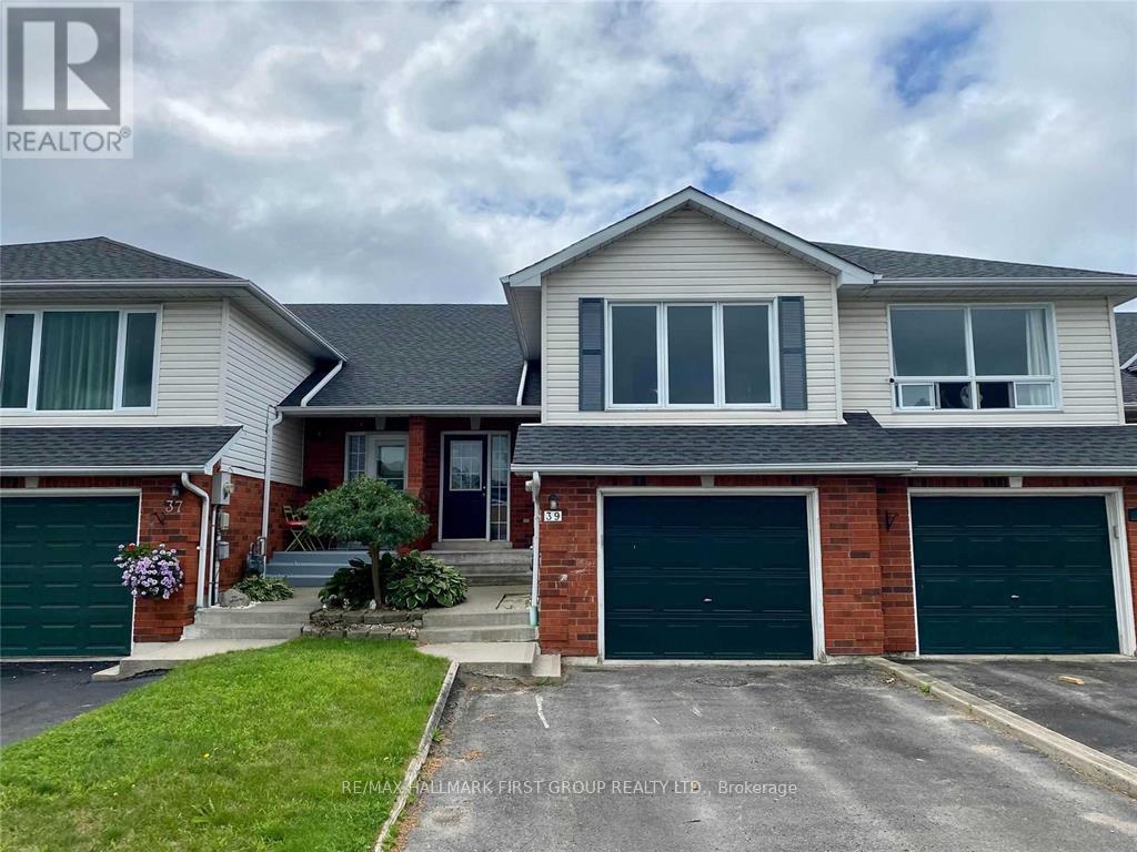 A two-story house with a garage is for sale.