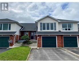 A two-story house with a garage is for sale.