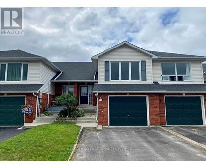 A two-story house with a garage is for sale.