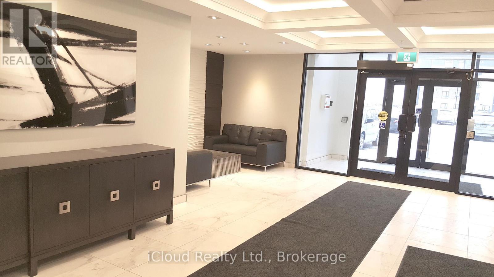 A black and white photo of a helicopter is on the wall of a modern office lobby.