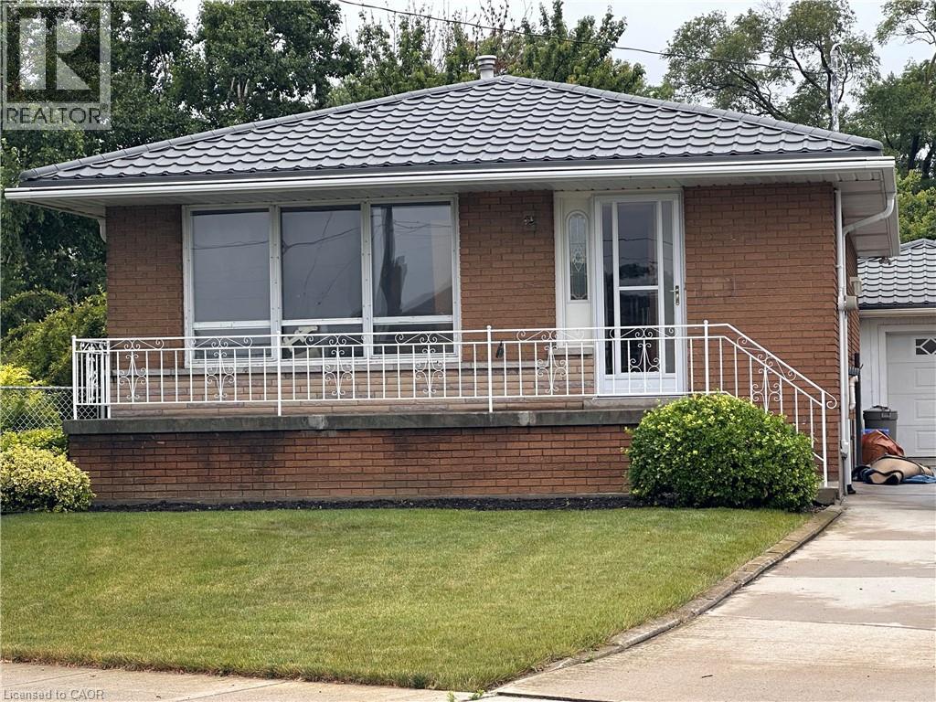 A small house with a white door and windows.