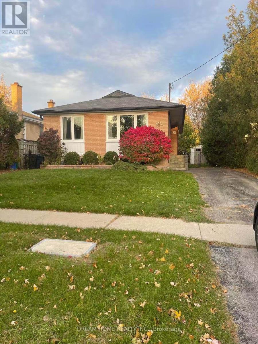 A house with a red flower in front of it.