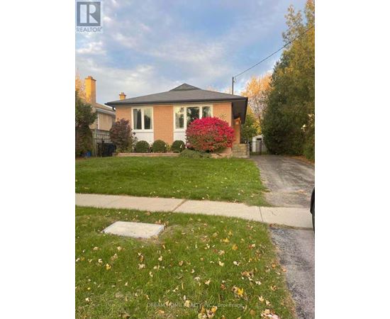 A house with a red flower in front of it.