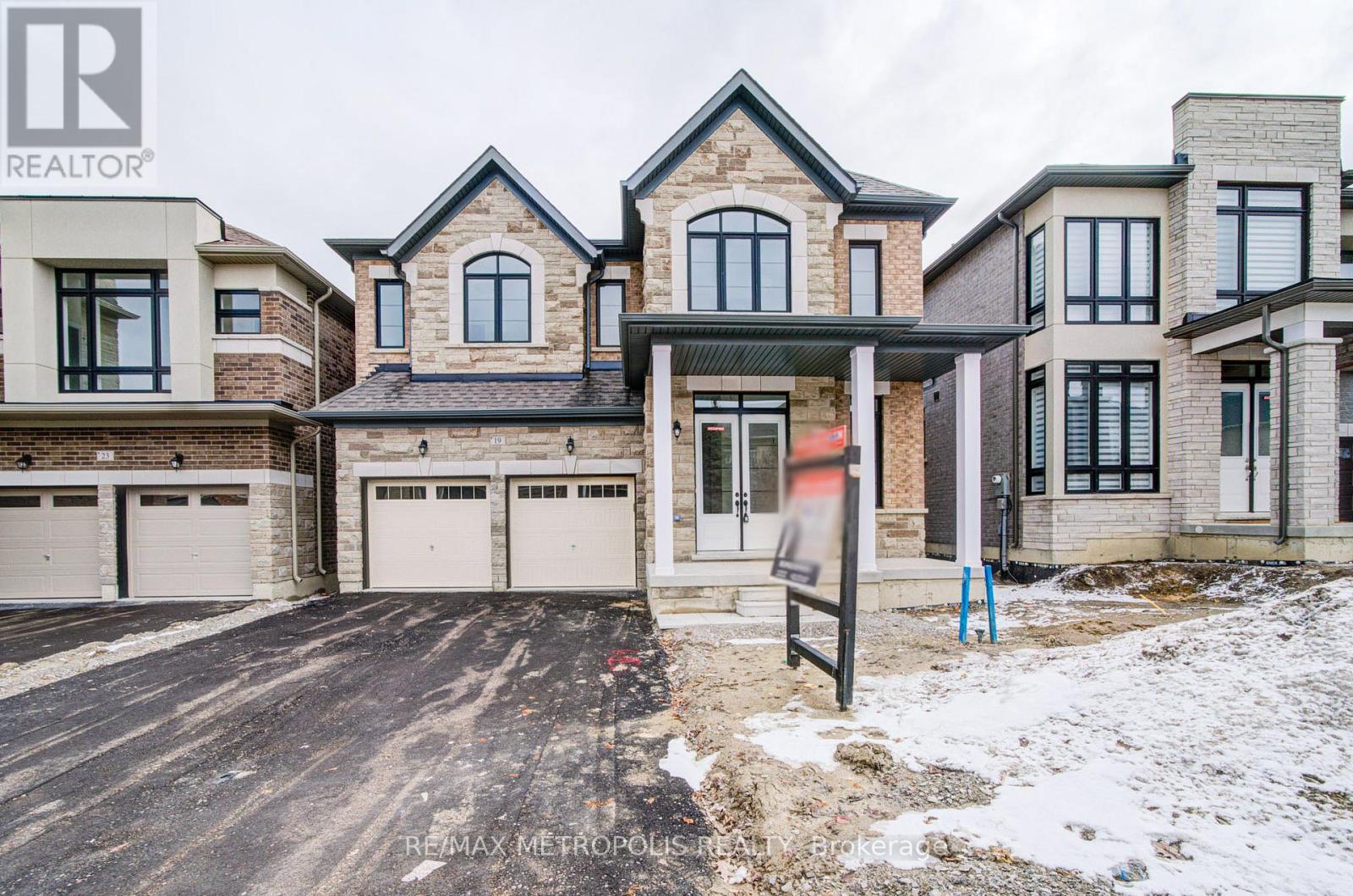 A large, multi-level house with a garage is for sale.