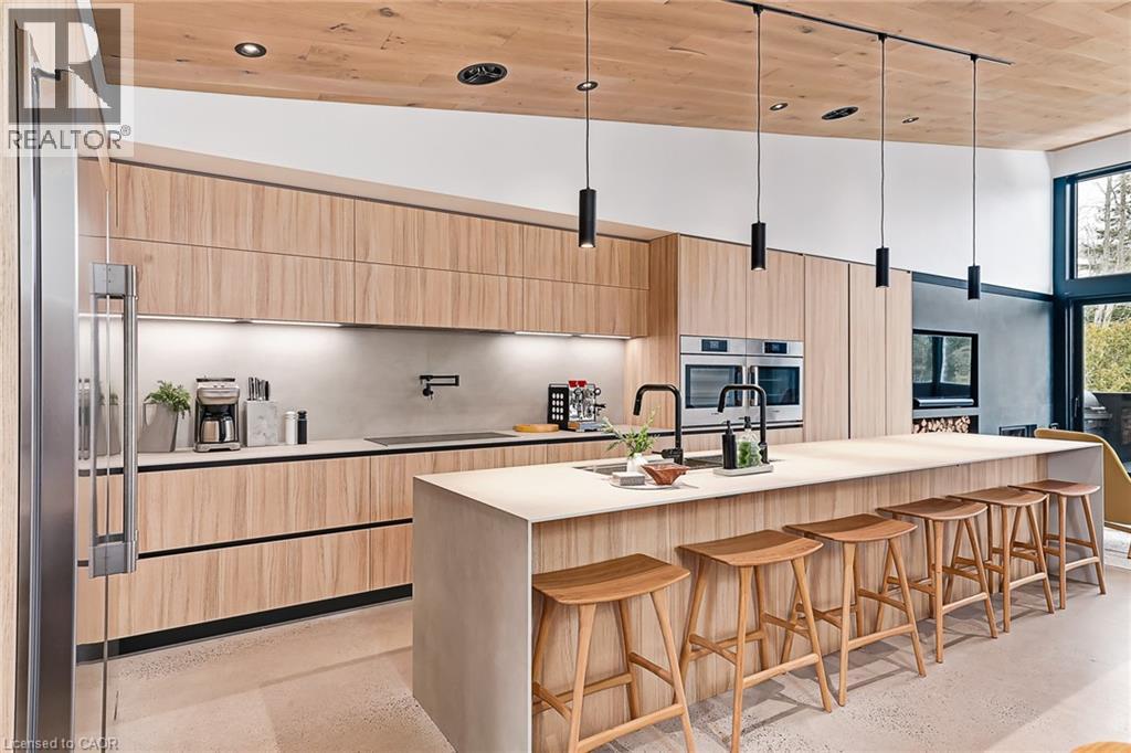 A modern kitchen with wooden cabinets and a central island.