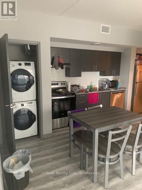 A modern kitchen with a table and chairs.