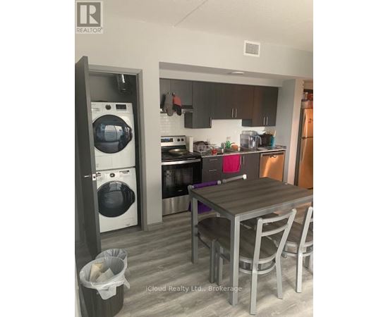 A modern kitchen with a table and chairs.