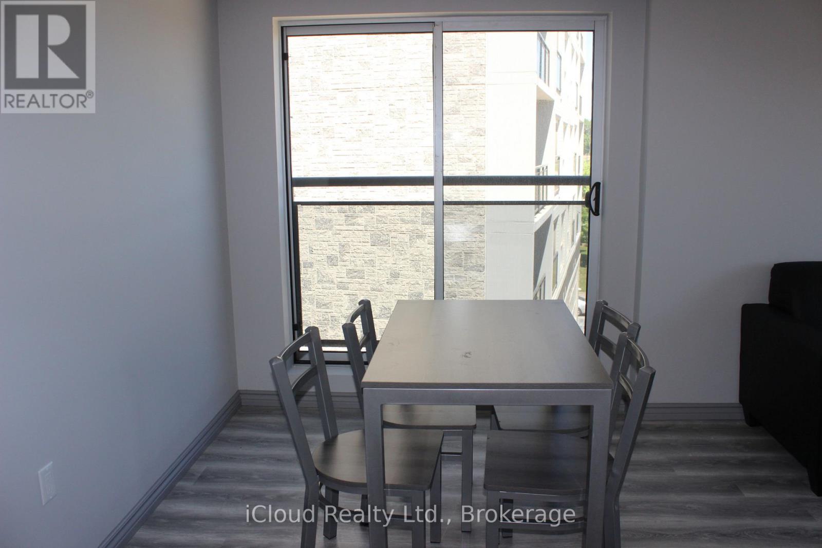 A dining room with a table and chairs is shown.