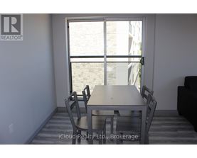 A dining room with a table and chairs is shown.