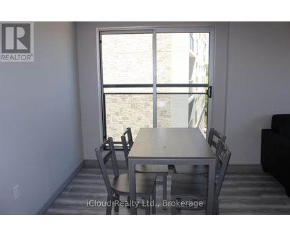 A dining room with a table and chairs is shown.