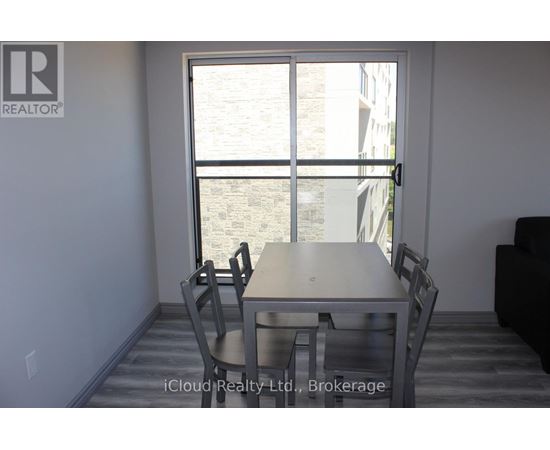 A dining room with a table and chairs is shown.
