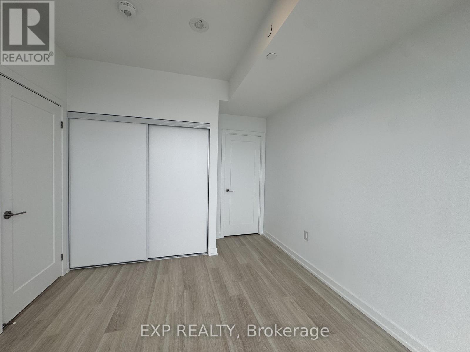 A room with EXP Realty Brokerage written on the floor.